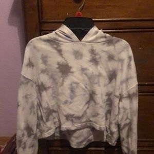 This is a Gray and white tie-dye cropped hoodie